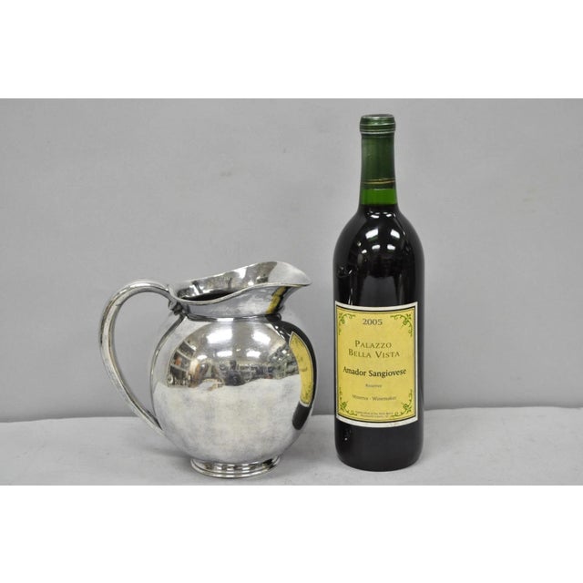 Vintage James Dixon & Sons Sheffield England Silver Plated Bulbous Water Pitcher. Circa Mid 20th Century. Measurements:...