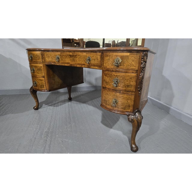 Outstanding Queen Anne style kidney shaped book matched burr walnut dressing table, with seven drawers brass handles,...