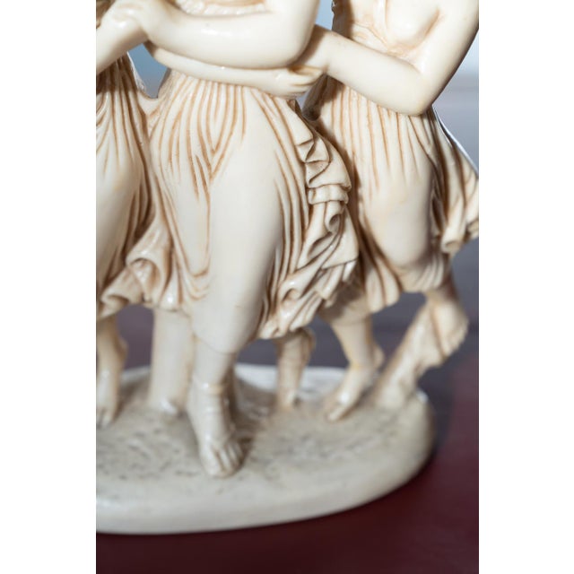 Add a touch of classical elegance to your home with this beautiful pair of resin sculptures from the 1970s/80s. Featuring...