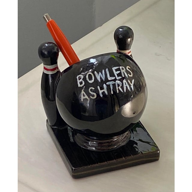 Fun ceramic ashtray in the shape of a bowling ball flanked by two pins. What more need we say? If you're not a smoker you...