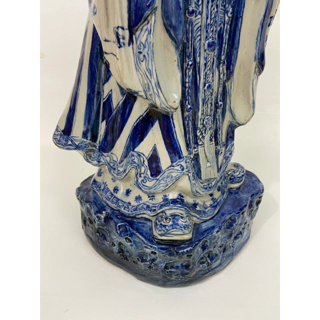 A single large antique Chinese blue and white pottery figure of an immortal.