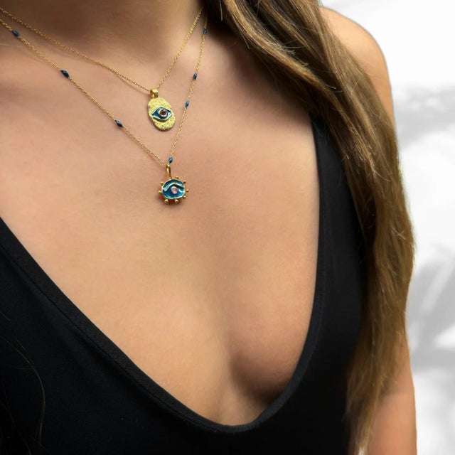 Blue Hittite Sun Pink Tourmaline Statement Necklace At the heart of the necklace is a radiant Hittite Sun pendant,...