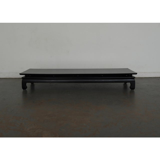 This vintage low coffee table reflects the clean, grounded aesthetic often associated with Century Furniture designs of...