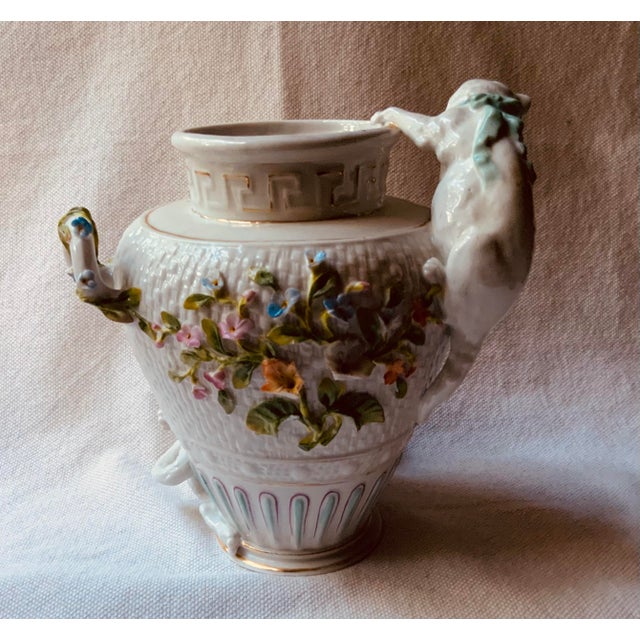 A delightfully whimsical and highly unique pair of late 19th to early 20th-century antique English Cottage Style porcelain...