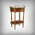 This small oval coffee table in mahogany and mahogany veneer, crafted in the refined Louis XVI style, captivates with its...