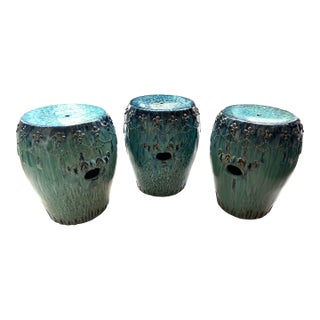 Curated Designer Set of 3 Large Teal Drip-Glazed Chinese Ceramic Garden Stools With Raised Garland Motif For Sale