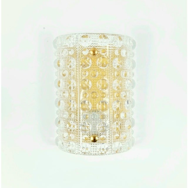 Stunning brass & crystal glass wall light designed by Carl Fagerlund for Swedish glasswork Orrefors in the 1960s. Rare...