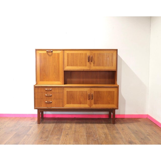 Step back in time with the Mid Century Modern Vintage Teak Tall Credenza Buffet by G Plan. Part of the distinguished G...
