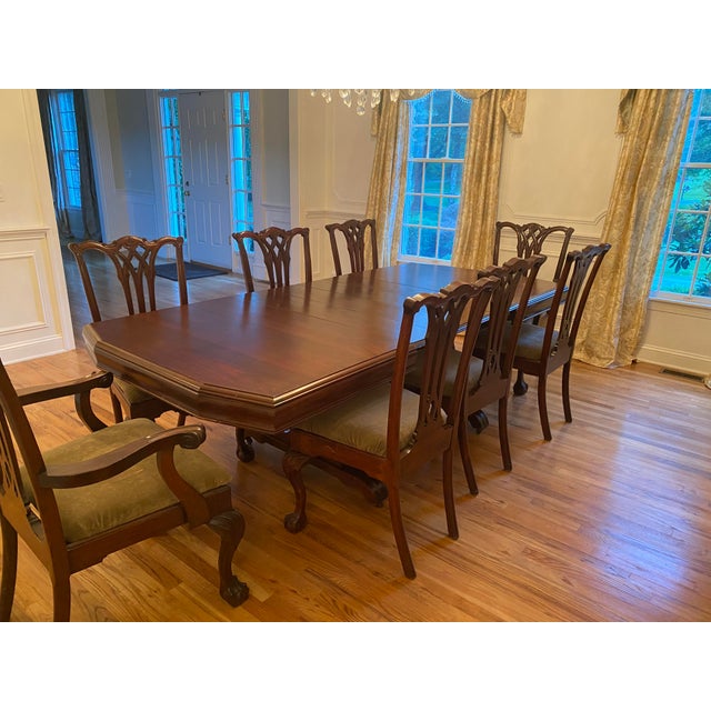 The expansive Solid Mahogany Chippendale Dining set has been restored, and absolutely beautiful with prominent grain...