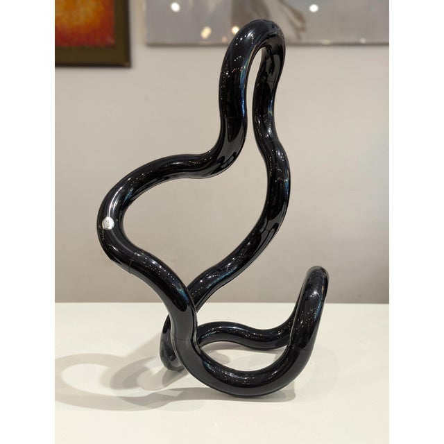 Extra-large black Tangle sculpture designed by Richard X. Zawitz, a celebrated exploration of interactive postmodern...
