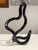 Extra-large black Tangle sculpture designed by Richard X. Zawitz, a celebrated exploration of interactive postmodern...