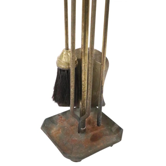 Nice Arts and Crafts style fireplace tool set in brass plated cast iron, and brass. The set includes the shovel, poker,...