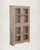 Bleached by sun and time to a pale, silvery tone, this antique Indian Armoire is calm and architectural. Four glass panels...