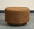 Pair of brown suede round ottomans/poufs, the "Mohave" by Nate Berkus + Jeremiah Brent for Living Spaces. Wood base. Made...