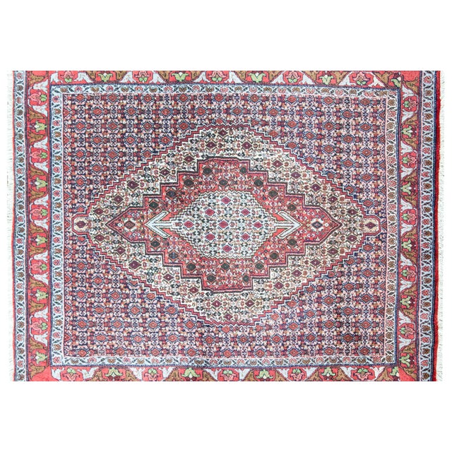 A late 20th-century Persian Bidjar rug, handwoven with extraordinary density and precision, featuring a central diamond...