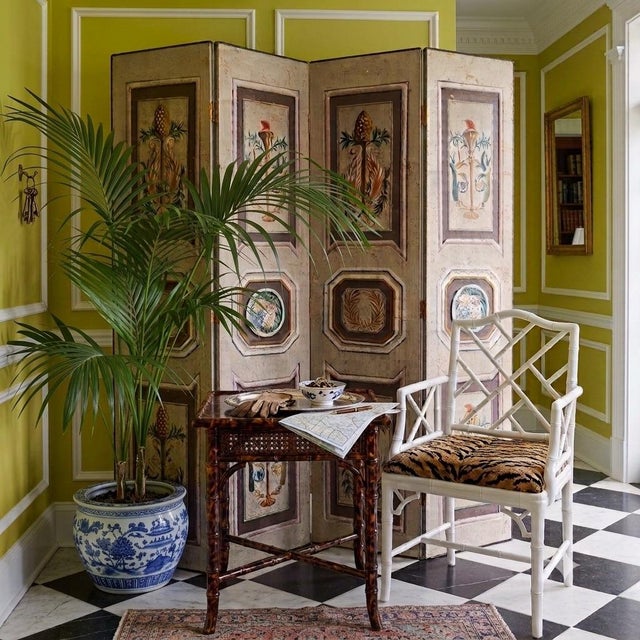 “A mid-century Continental hand-painted folding screen in the Louis XVI manner, each of its four panels rendered in trompe...
