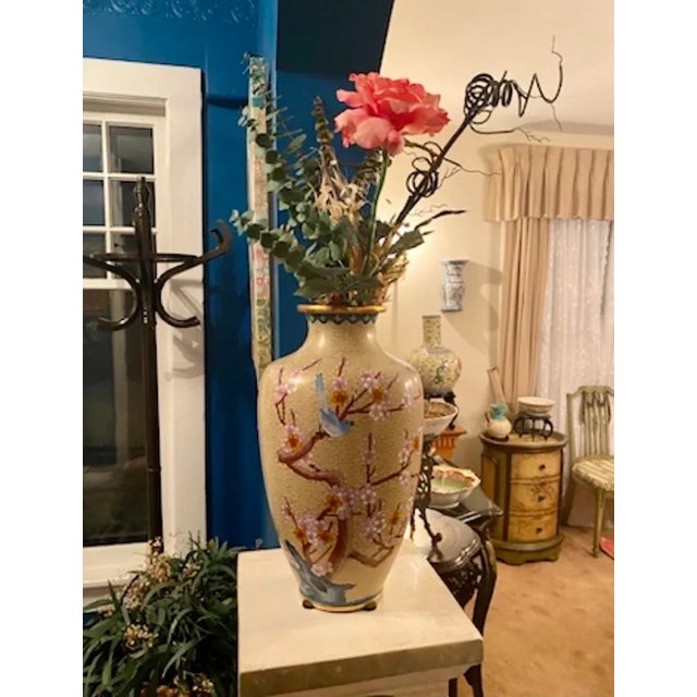 Large Cloisonné Vase With Bluebirds and Cherry Blossoms. The age of the vase is unknown, but based on the number and size...