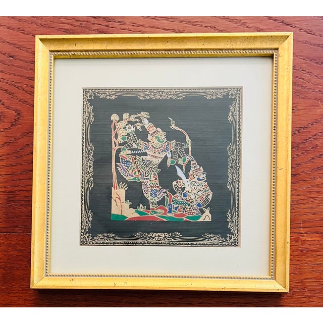 Framed and matted, 3 Thai silk paintings depicting traditional mythological scenes with figures in costume with...