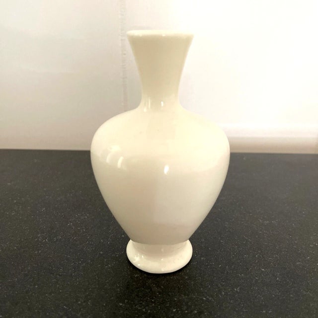 A nice little Lenox vase that is just under 4" tall and in very nice condition. Creamware with no trim. Material-Porcelain