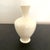 A nice little Lenox vase that is just under 4" tall and in very nice condition. Creamware with no trim. Material-Porcelain