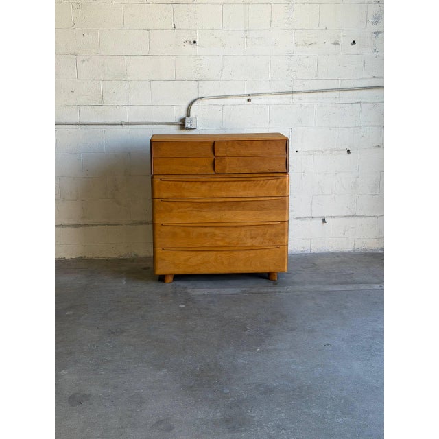 An iconic architectural form balances sculptural curves with clean lines in this classic storage piece. The design...