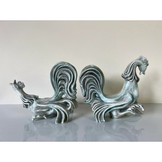 Lovely pair of Vintage art handmade pottery rooster sculptures by Jodie. C,1964. hand signed on the bottom. Dimensions :...