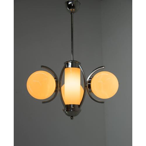 Completely restored, cleaned, polished, rewired. Original glass shades in ivory color without any damage. Nickel with age...