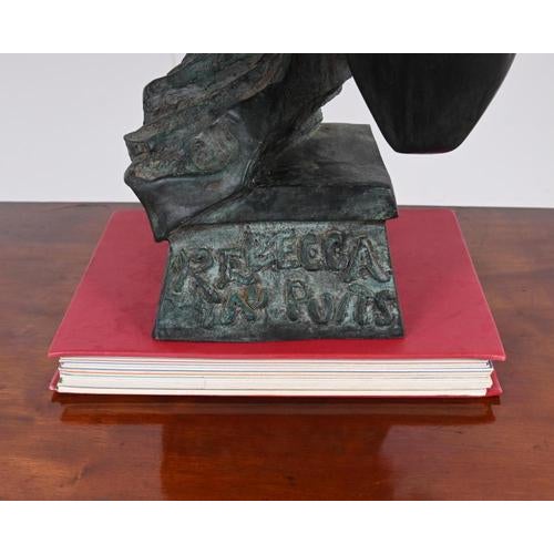 The statue in the image is a French Art Nouveau bronze bust titled Rebecca au Puits (Rebecca at the Well) cast after the...