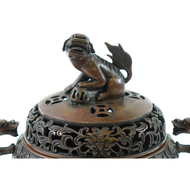 Beautiful Antique Chinese Bronze Tripod Urn with Foo Dog – 9” x 9” This intricately cast antique Chinese bronze tripod urn...