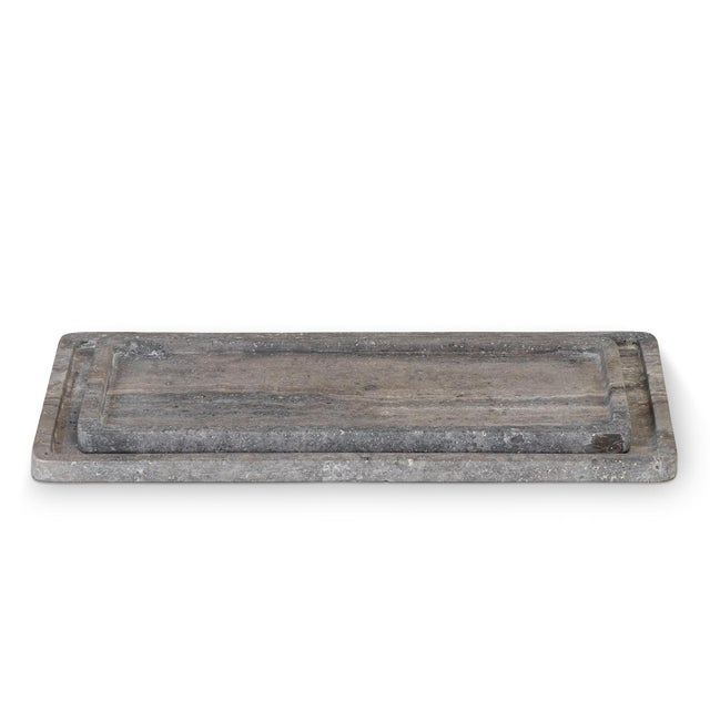 The rectangular Sutton Tray Set combines a rustic look with a chic material. Whether on a bedside table, in the living...