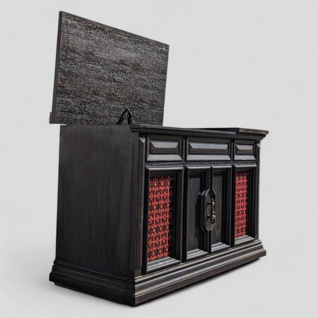 Bring timeless design and sound into your home with this vintage 1970s Zenith stereo console in a handsome dark wood...