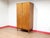 A stunning wardrobe by renowned British furniture maker Alfred Cox, this Mid Century Modern Teak Wardrobe Armoire...