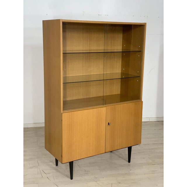 A very nice vintage highboard. • german design • 70s • cherry tree • key available • good condition dimensions: height:...