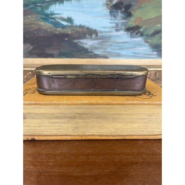 This finely crafted 19th century likely Dutch snuff box is a richly detailed example of utilitarian folk art, made of...
