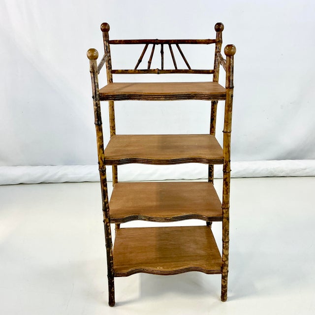 This is a very well kept Antique Scorched Bamboo Ball & Stick Etagere. It’s English from the Aesthetic Movement era of the...