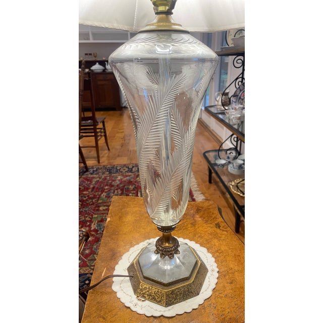 A set of 1940's Hollywood Regency style etched crystal table tamps that add understated elegance to any room. Design...