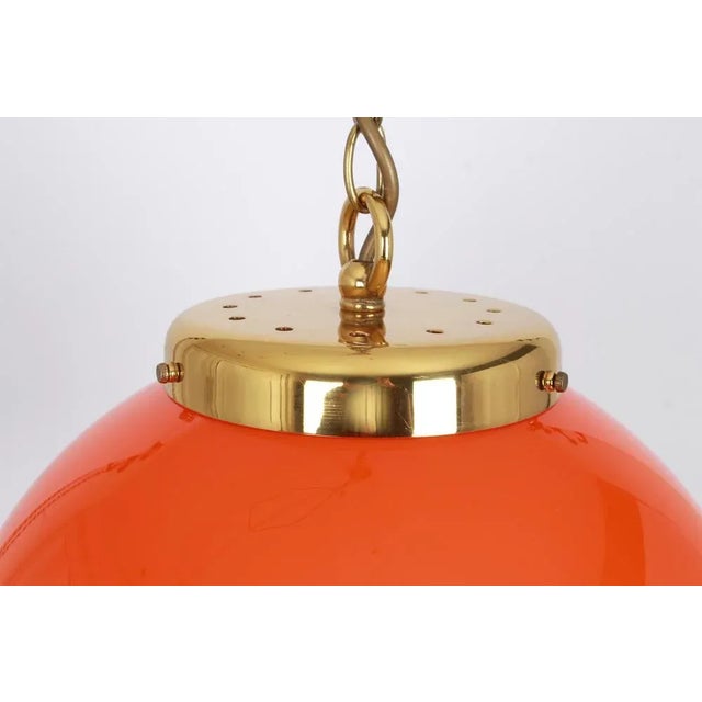 Orange glass pendant light by peill & putzler, manufactured in germany circa the 1970s. High quality and in very good...