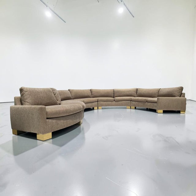 Incredible multi-piece 1970s vintage sectional sofa with thick brass wrapped feet. This sofa has a very unique shape that...