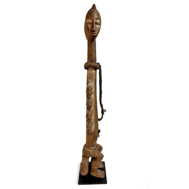 This striking vintage West African sculptural figure is a Baule-influenced male/female fertility and ancestral form, hand-...
