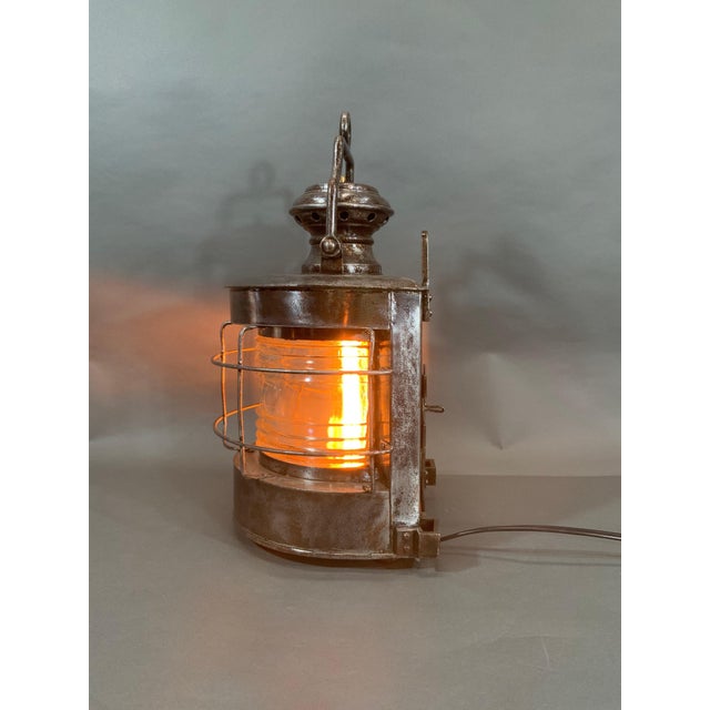 Ship's masthead lantern with protective cage, Fresnel lens, ac wiring, vented top, carry handle, etc. Sturdily built....