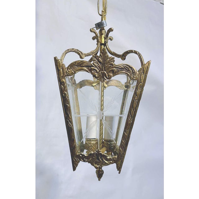 Bronze Lantern With Etched Glass Panels. It has 3 light with candelabra base sockets that each holds a 75W light bulbs or...