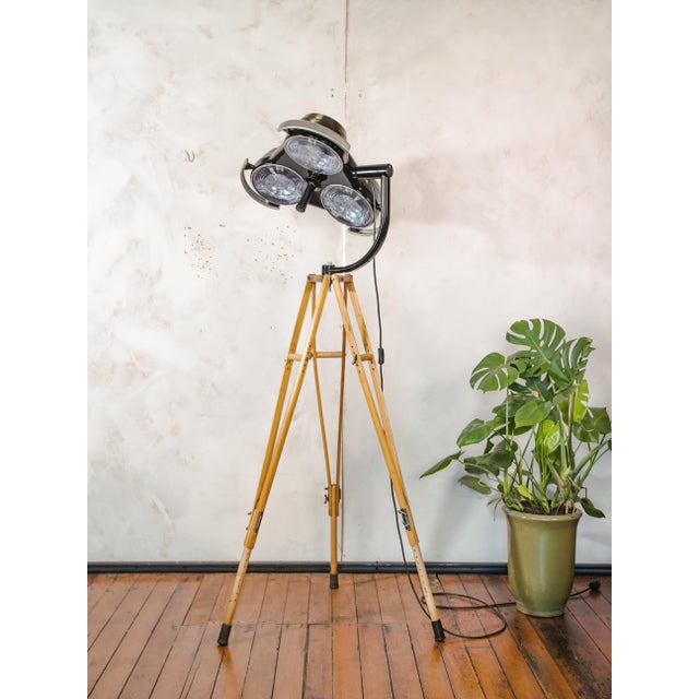 A 1990s heraeus hanaulux model 2003 three-way shadowless surgical lamp, reworked into a floor lamp and mounted on a tripod...