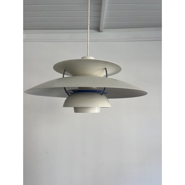 This iconic ph5 pendant lamp by louis poulsen is a masterpiece of form and function. The soft, glare-free glow creates...