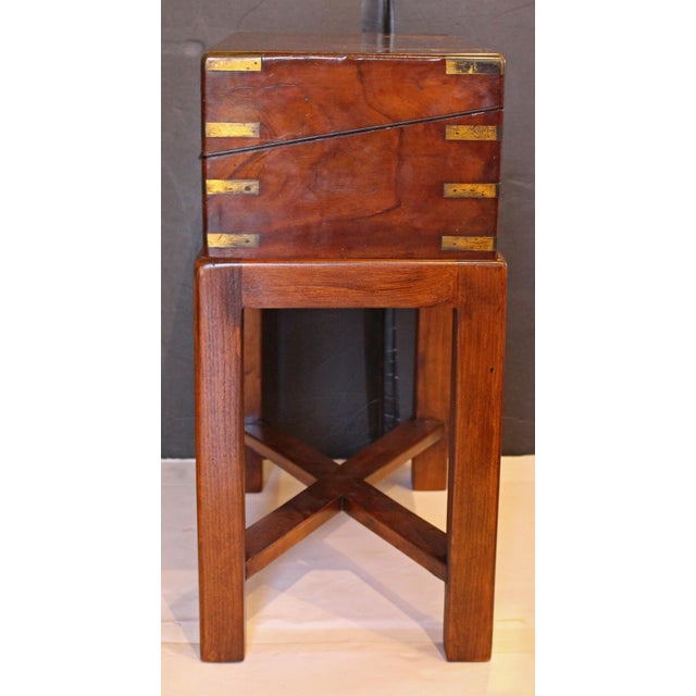Circa 1830-60 lap desk writing box on custom side table stand, English. Highly figured walnut with full brass bindings...