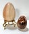 A sculptural pair of oversized vintage polished stone eggs, each displaying distinctive natural veining and earthy mineral...