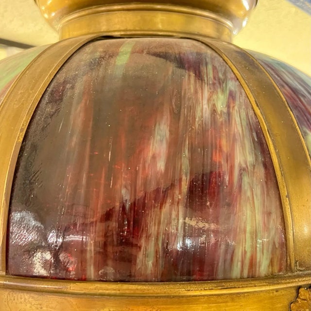 Vintage multi-colored glass and metal hanging lamp / chandelier in the Arts and Crafts style.