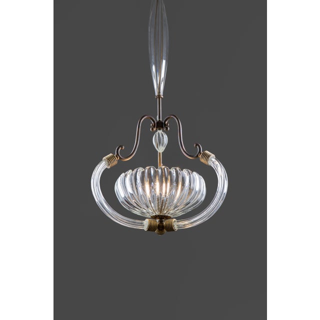 Barovier and toso chandelier in murano glass handmade by art deco master glass craftsmen in the 1930s. The sculptural...