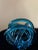 "Blue Ocean Swirl" is a unique piece of Glass Art. The multi-blue colors react to light for a stunning glow. Each side...