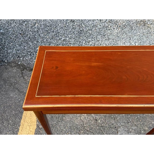 Antique Federal style petite sized flip top game console table It features rectangular-shaped top , four tapered legs, 1...