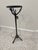 Sculptural organic modern pedestal side table featuring a cast iron branch-form base with a dark patinated finish and...